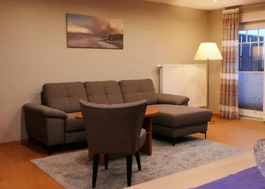 Wohnzimmer in einer Ferienwohnung im Appartementhaus Dallacker in Duhnen